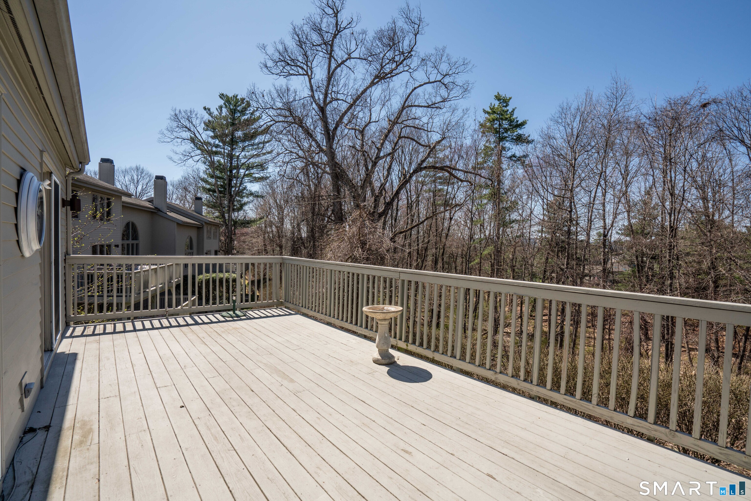 3 Shirecrest, Unit 3 Avon, CT 06001 - Photo 29 of 32 a balcony with wooden floor and fence