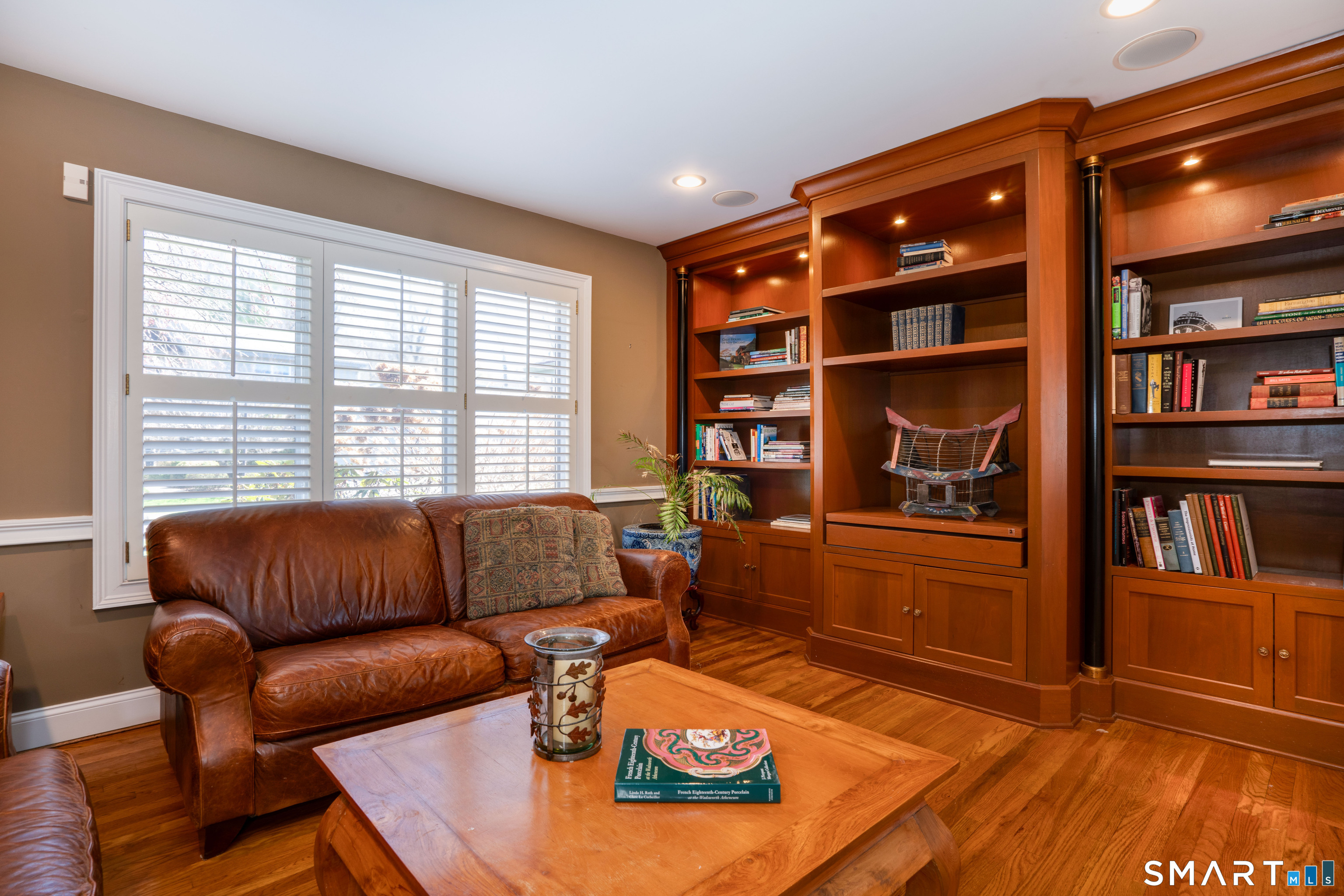 3 Shirecrest, Unit 3 Avon, CT 06001 - Photo 10 of 32 a living room with furniture and a book shelf