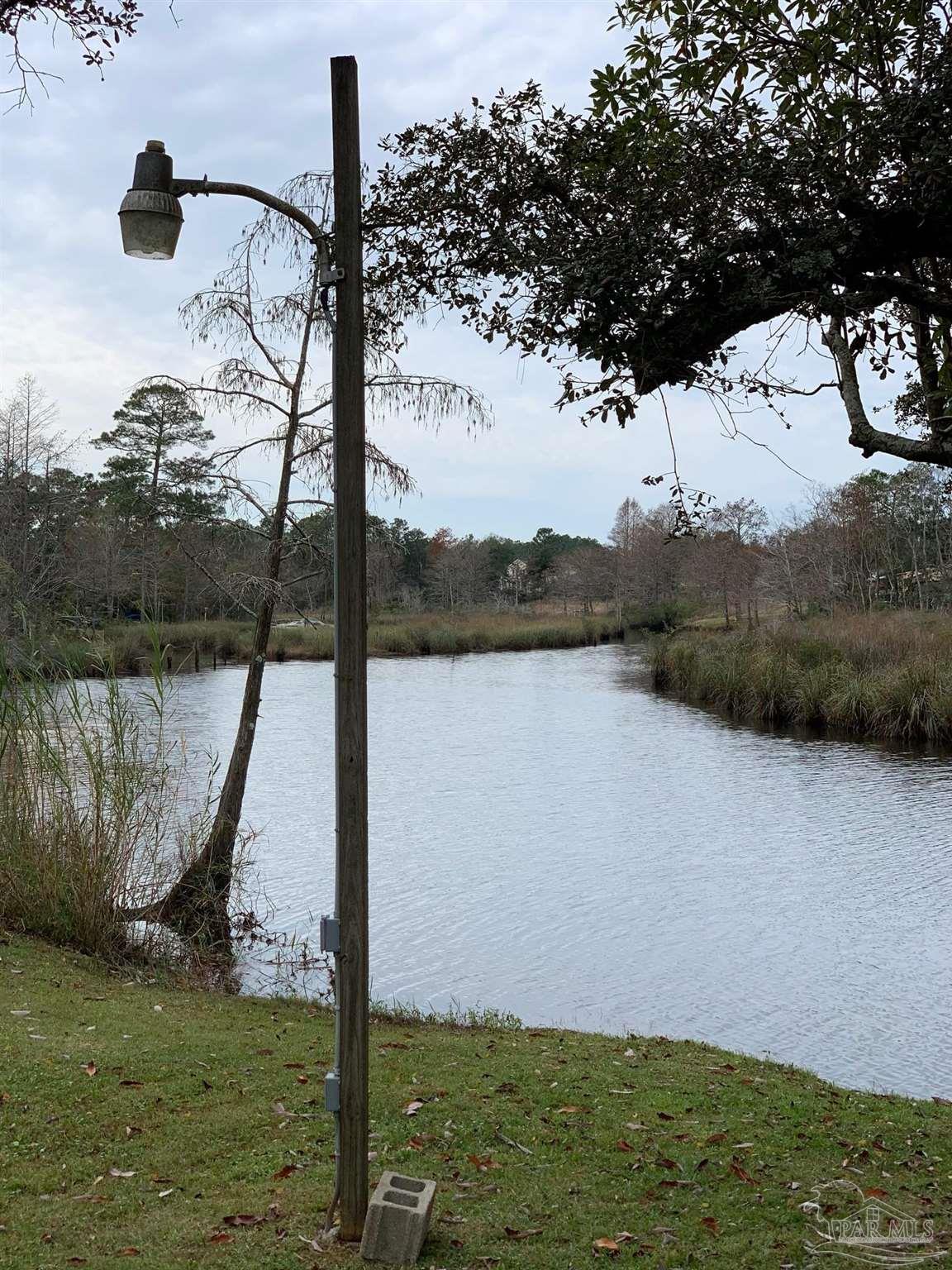 609 Dog Track Road Pensacola, FL 32506 - Photo 9 of 22 a view of a lake