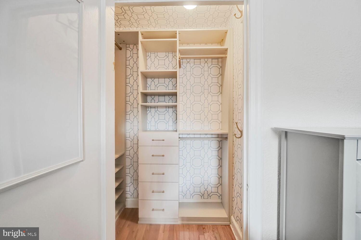 2040 Belmont Road Northwest, Unit 628 Washington, DC 20009 - Photo 13 of 19 a view of walk in closet with empty racks
