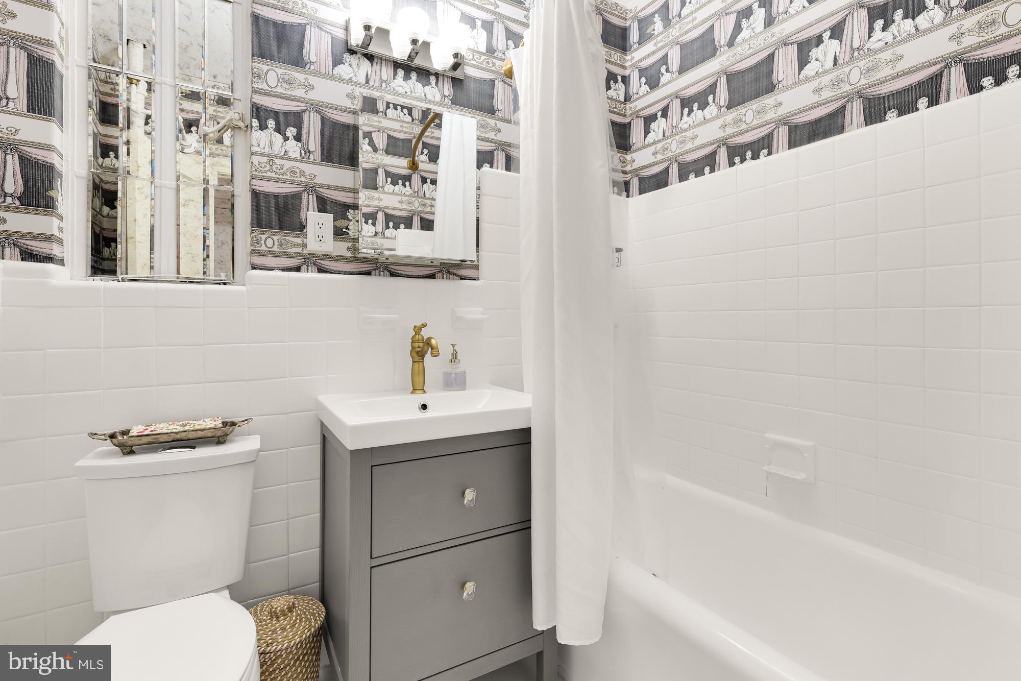2040 Belmont Road Northwest, Unit 628 Washington, DC 20009 - Photo 14 of 19 a bathroom with a sink a toilet and shower