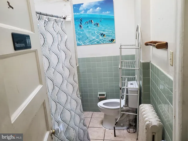 a bathroom with a toilet and a sink