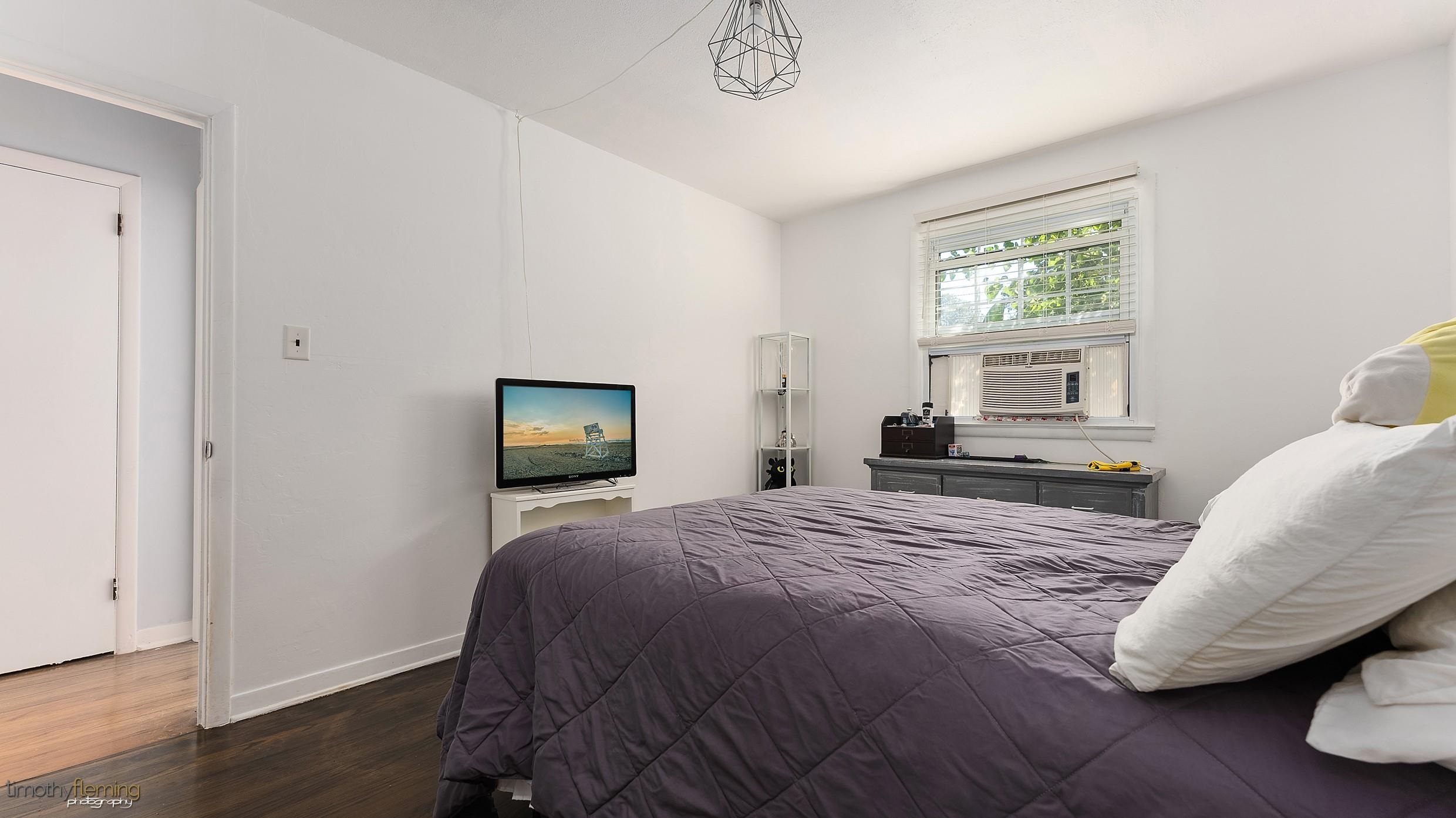 7 North 4th Street Rio Grande, NJ 08242 - Photo 13 of 20 a bedroom with a bed and wooden floor