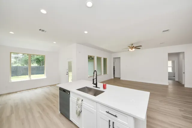 a kitchen with sink and window