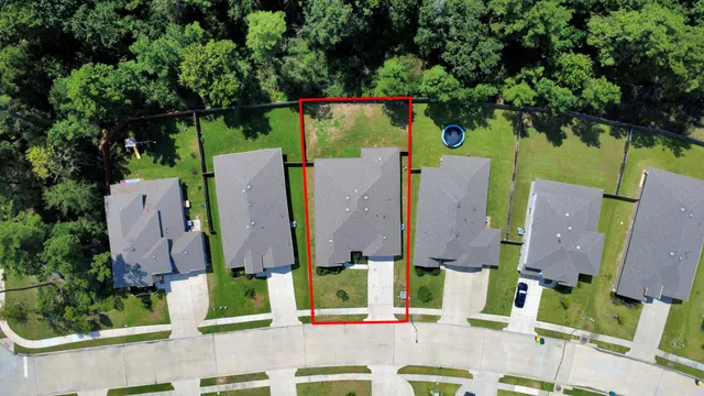 an aerial view of residential house with outdoor space and parking