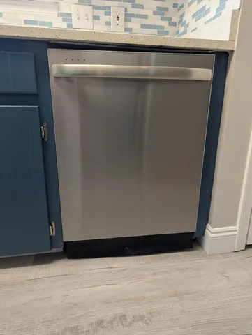 a view of a kitchen from the hallway