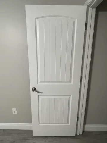 a bathroom with a toilet and shower