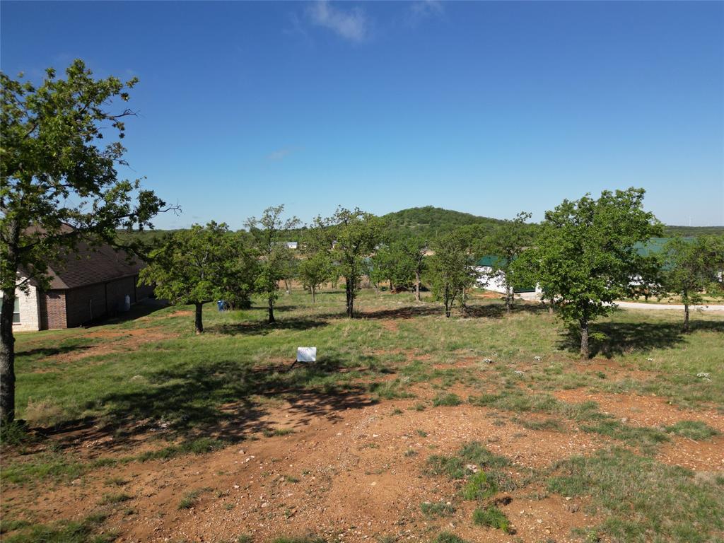 101 Overlook Drive Cisco, TX 76437 - Photo 2 of 10 a backyard of a house with lots of green space
