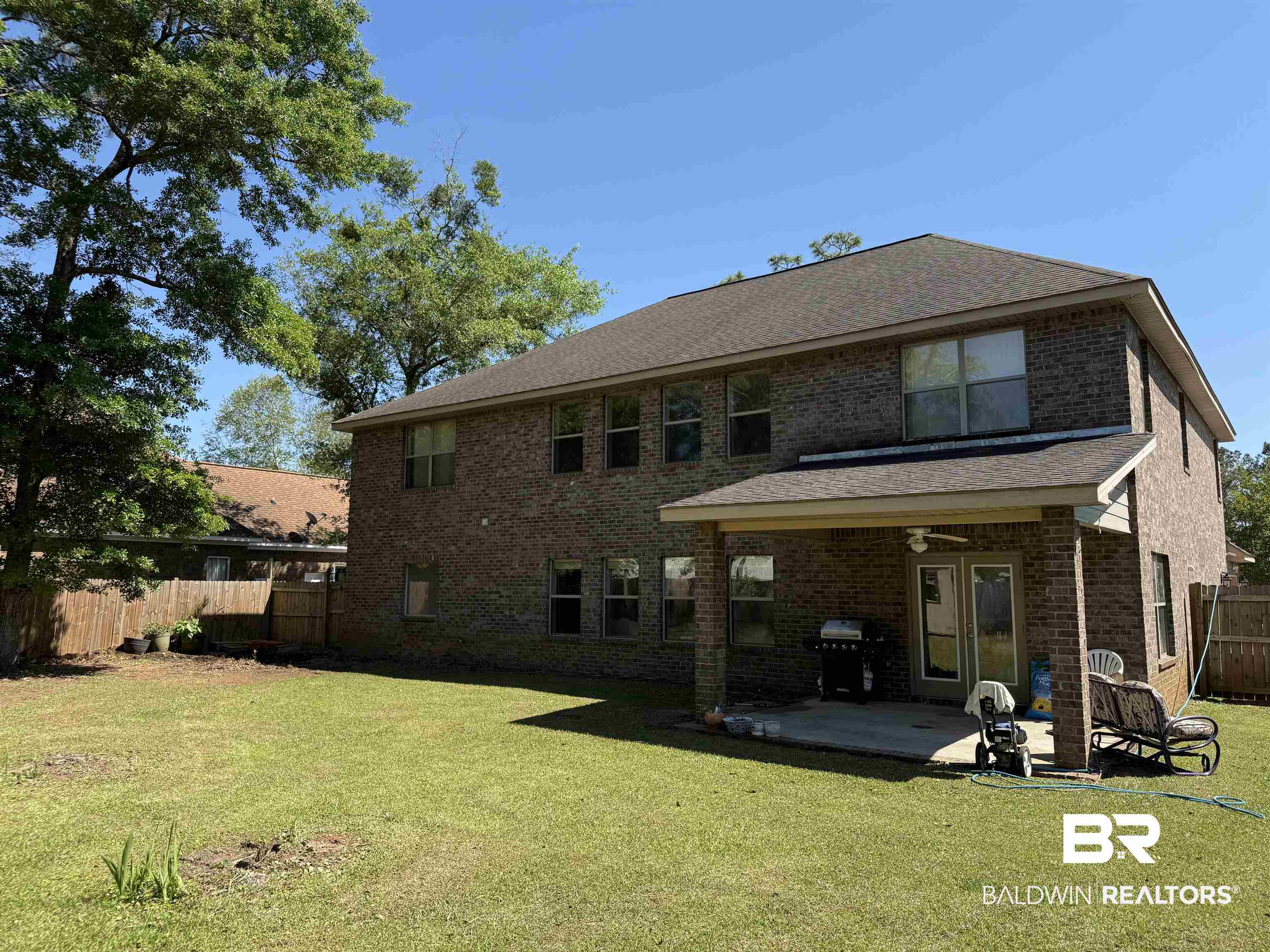9023 Krystal Ridge Court Daphne, AL 36526 - Photo 38 of 41 Rear view of property with a fenced backyard, a patio, brick siding, and roof with shingles