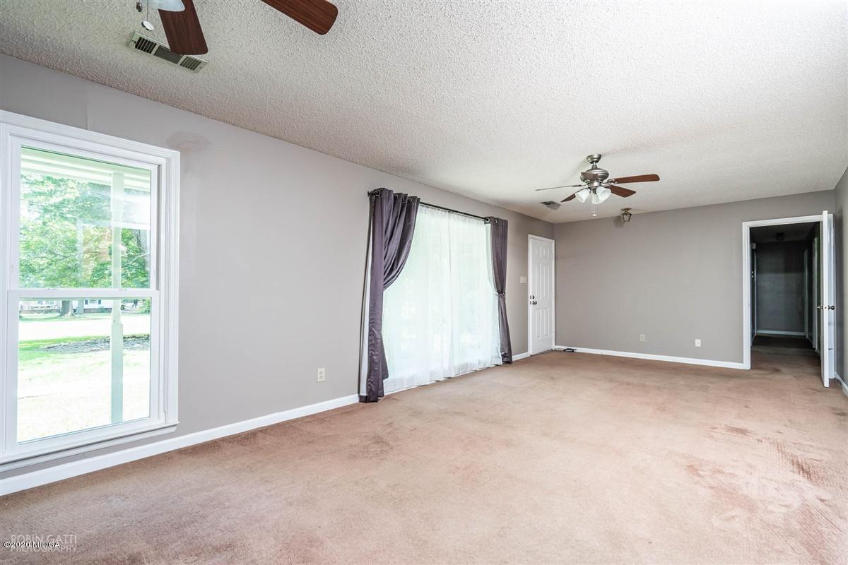 243 Lake Joy Road Perry, GA 31069 - Photo 11 of 29 a view of empty room with windows