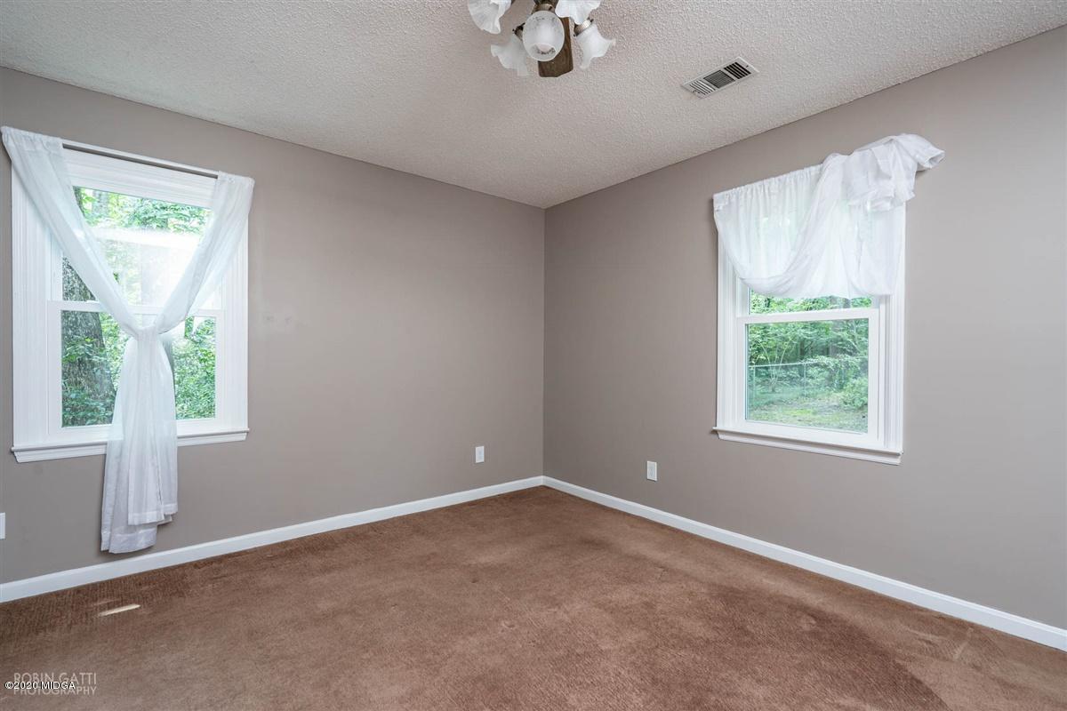 243 Lake Joy Road Perry, GA 31069 - Photo 12 of 29 a view of an empty room with a window