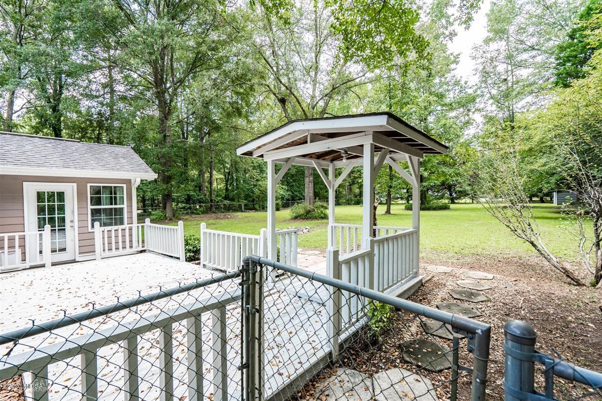 243 Lake Joy Road Perry, GA 31069 - Photo 23 of 29 a house view with a sitting space and garden space