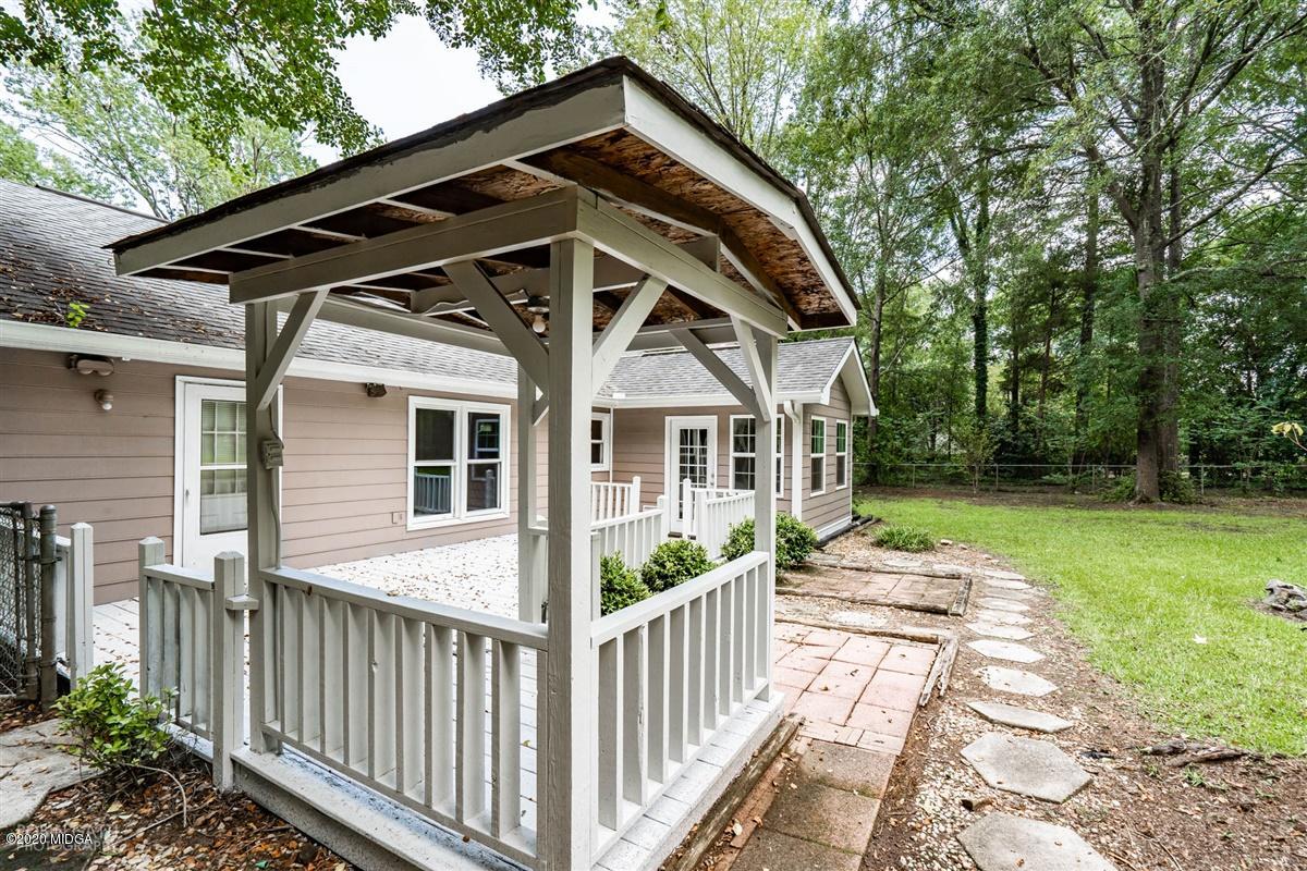 243 Lake Joy Road Perry, GA 31069 - Photo 25 of 29 a front view of a house with garden
