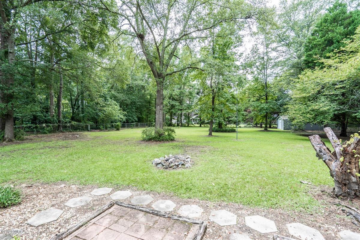 243 Lake Joy Road Perry, GA 31069 - Photo 26 of 29 a view of a backyard with large trees