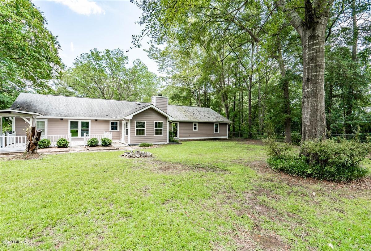 243 Lake Joy Road Perry, GA 31069 - Photo 29 of 29 a front view of a house with yard and green space
