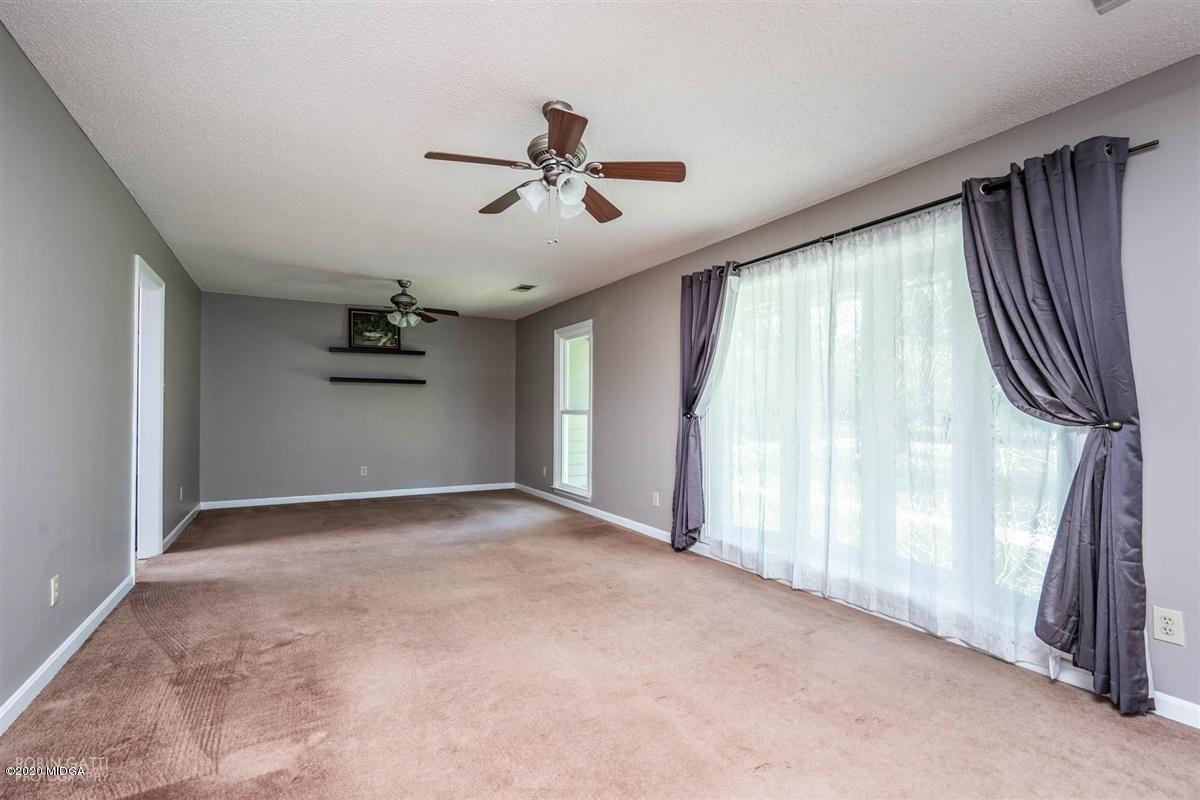 243 Lake Joy Road Perry, GA 31069 - Photo 10 of 29 a view of empty room with windows