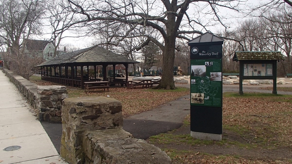 85 Trapelo Road, Unit 40 Waltham, MA 02452 - Photo 11 of 15 a front view of a house with a yard