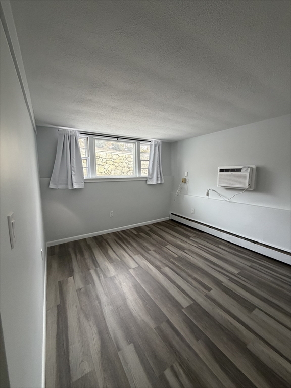 85 Trapelo Road, Unit 40 Waltham, MA 02452 - Photo 3 of 15 wooden floor in an empty room