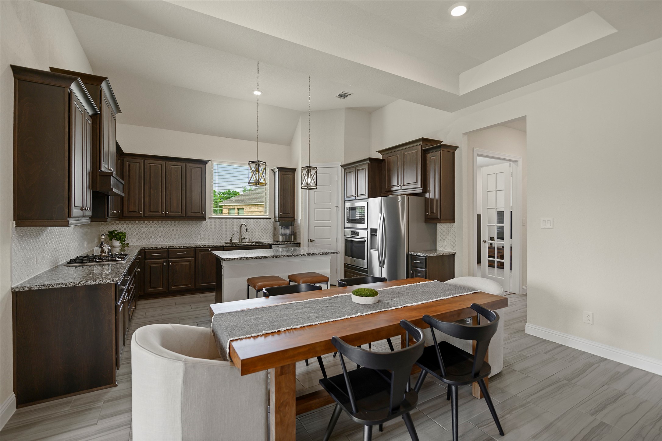 20330 Rosegold Way Spring, TX 77379 - Photo 3 of 48 Dining area easily accommodates gatherings and opens directly to the kitchen and living room.