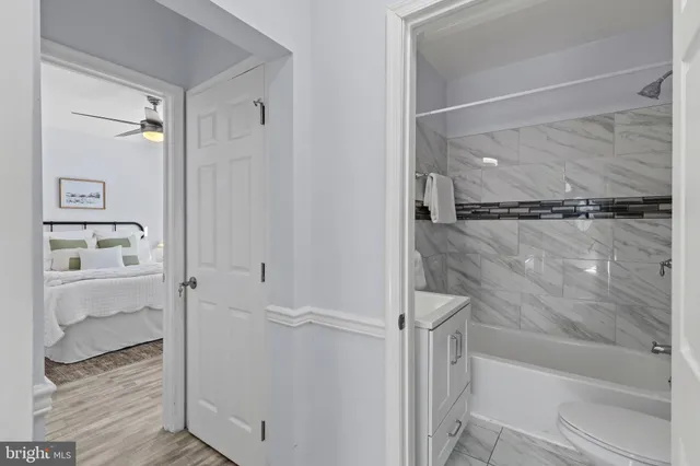 a bathroom with a glass shower door