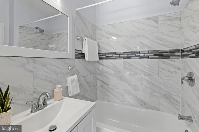 a bathroom with a sink and a shower