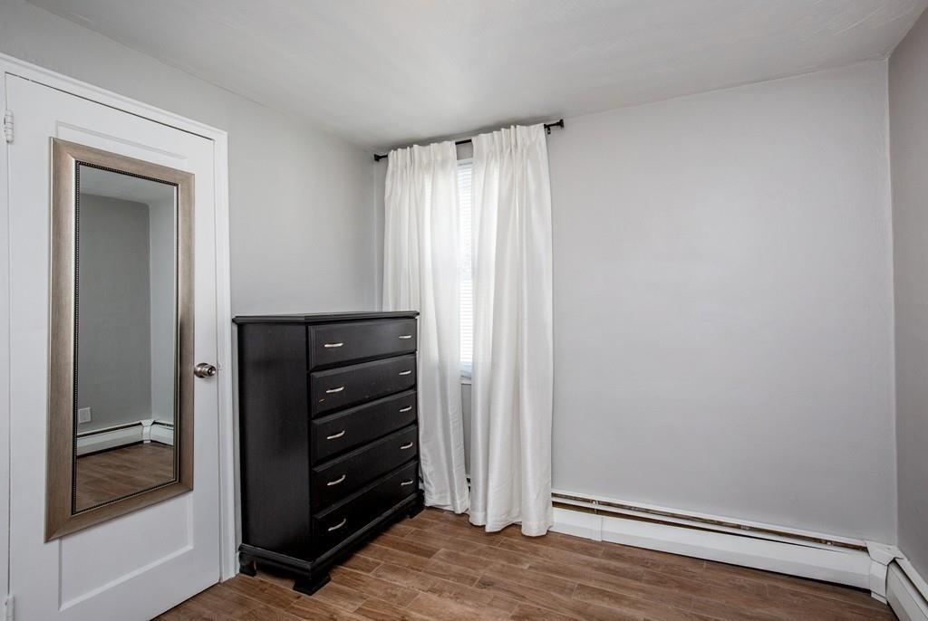 21 Forest Street Peabody, MA 01960 - Photo 17 of 29 a view of room with closet and wooden floor