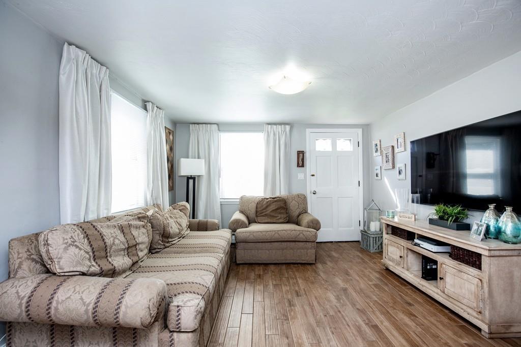 21 Forest Street Peabody, MA 01960 - Photo 4 of 29 a living room with furniture and a flat screen tv