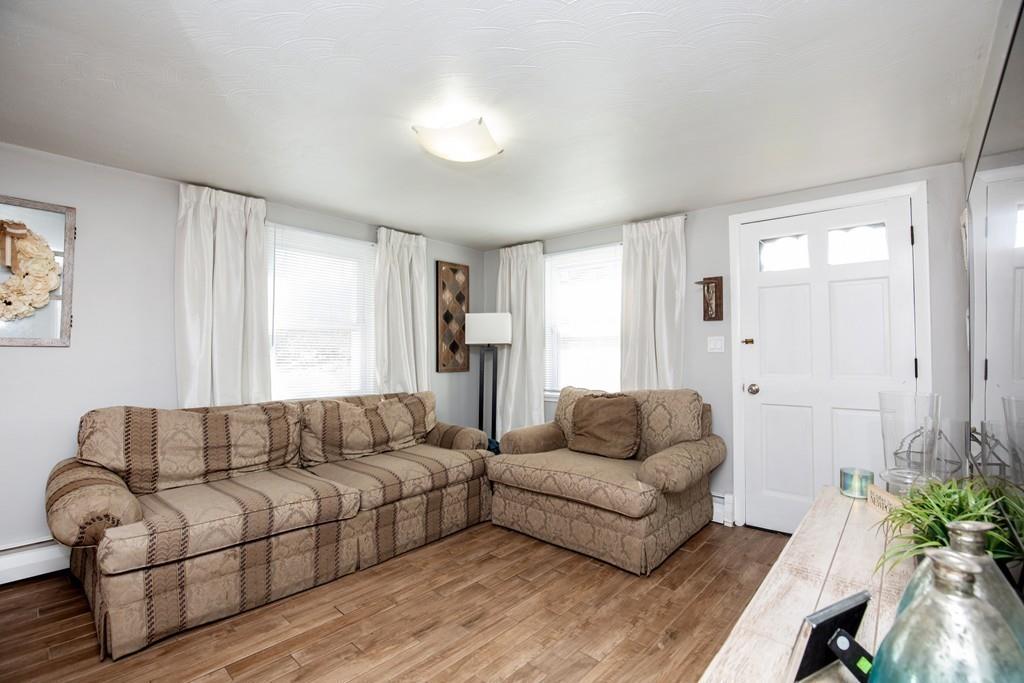 21 Forest Street Peabody, MA 01960 - Photo 5 of 29 a living room with furniture and a couch