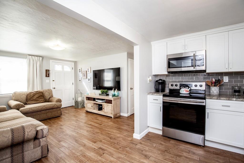 21 Forest Street Peabody, MA 01960 - Photo 7 of 29 a living room with furniture and a flat screen tv