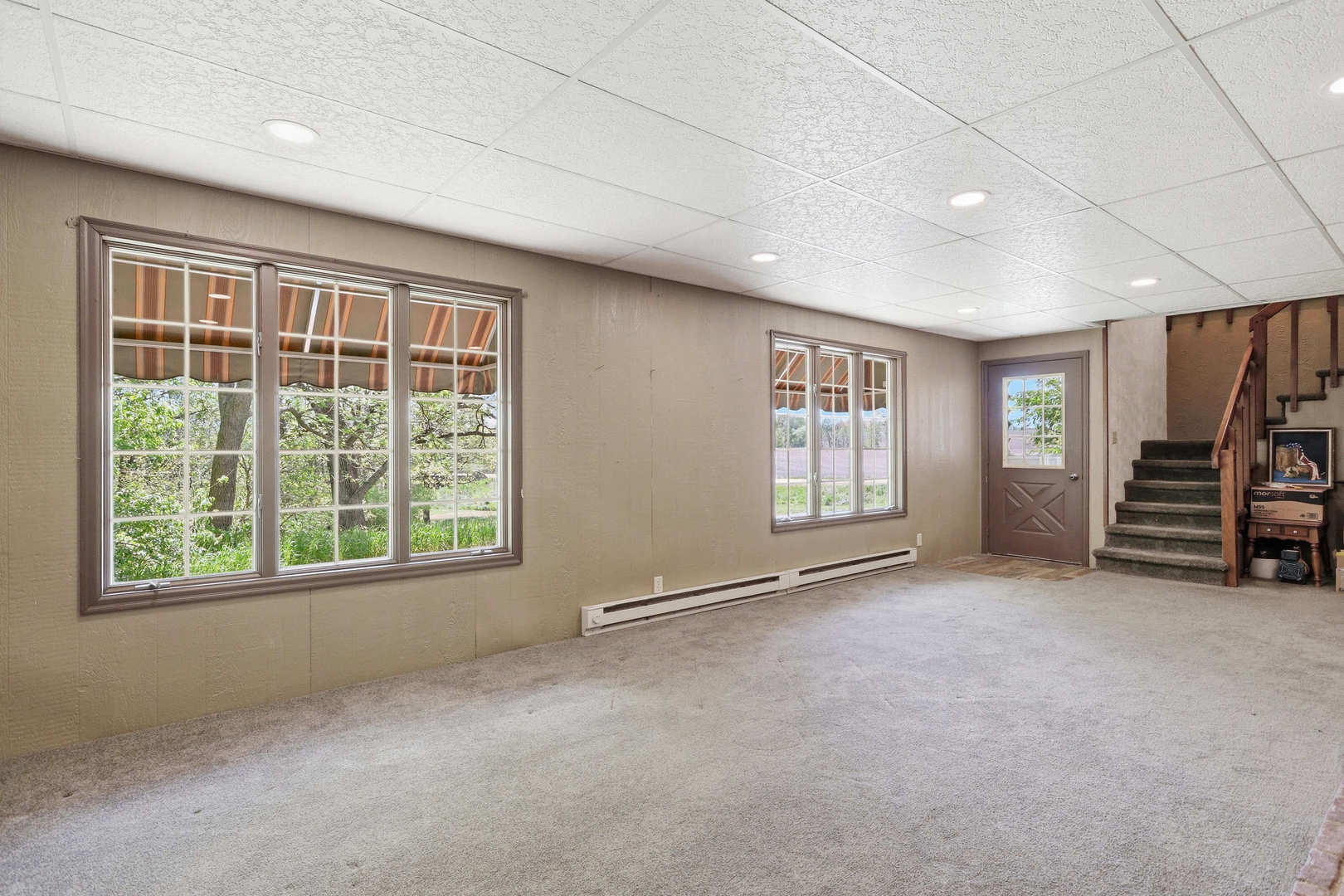 2660 252nd Street De Witt, IA 52742 - Photo 32 of 45 a view of an empty room with a fireplace and a window