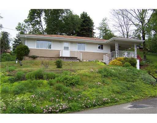 144 Morgan Hill Road Cuddy, PA 15031 - Photo 1 of 18 Exterior Front. Quality built 2 BR with patio over carport.