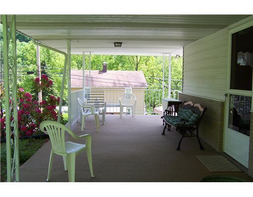 144 Morgan Hill Road Cuddy, PA 15031 - Photo 2 of 18 Patio/Deck. Patio off kitchen leads to rear yard and vegitable patch.