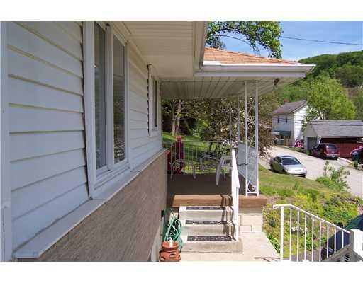 144 Morgan Hill Road Cuddy, PA 15031 - Photo 17 of 18 Exterior Front. NOTE THE LARGE OVERHAND WITH NEW SOFFIT/FACIA.