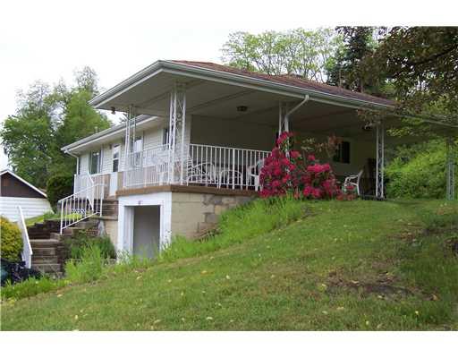 144 Morgan Hill Road Cuddy, PA 15031 - Photo 4 of 18 Patio/Deck. Note the large overhang, new soffit/facia and handrails.