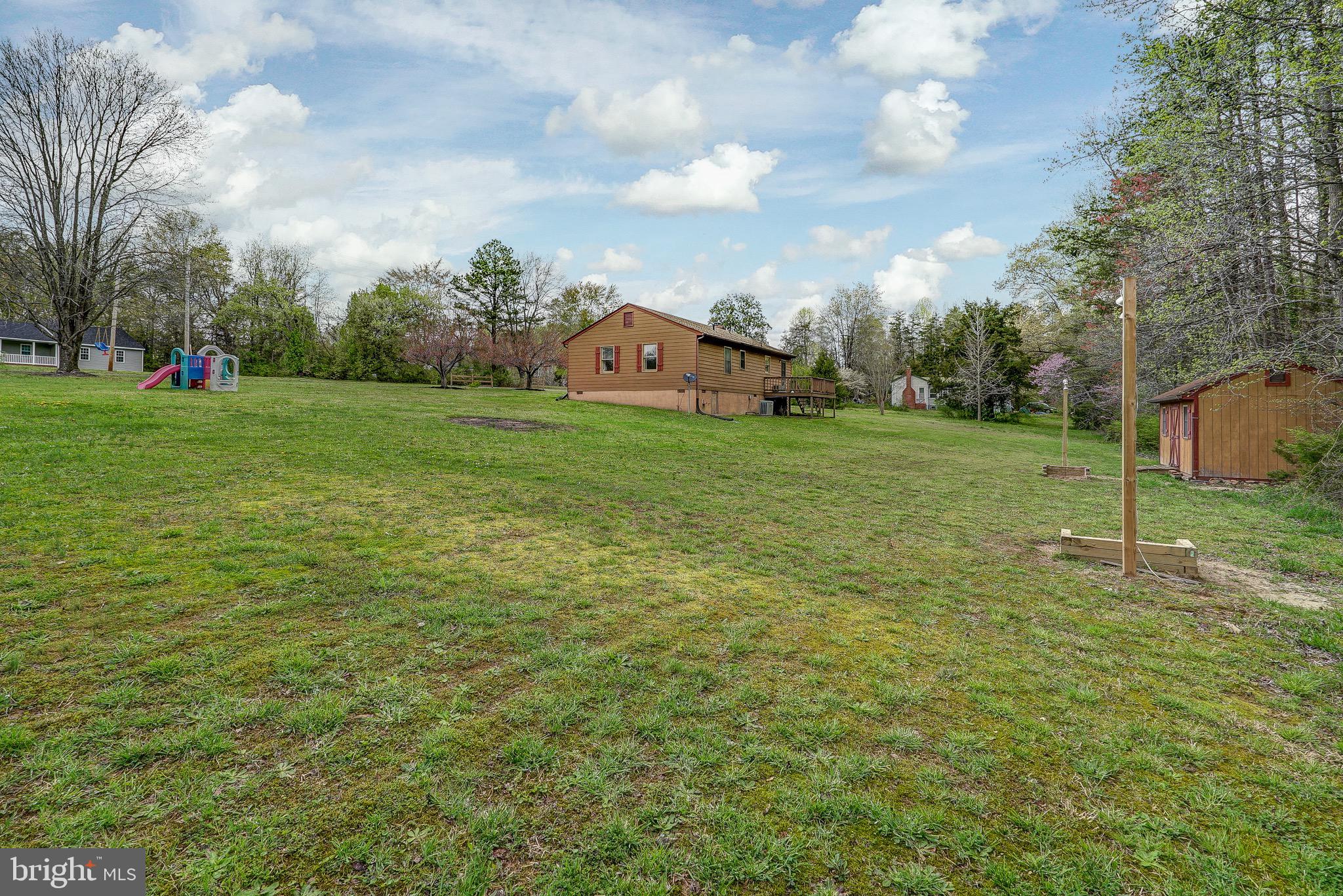 144 Buckner Road Bumpass, VA 23024 - Photo 43 of 46 Backyard view with lighted horse shoe pits