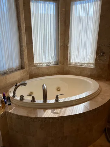a view of a bathtub in a bathroom