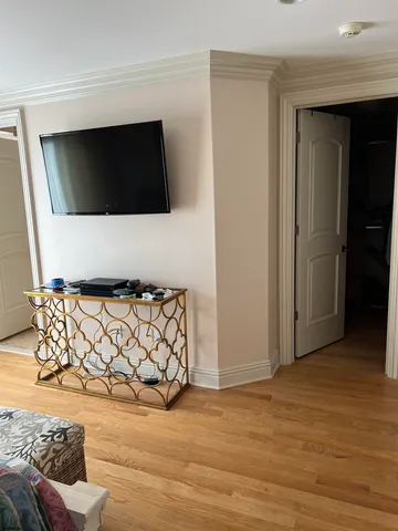 a living room with a couch and a flat screen tv