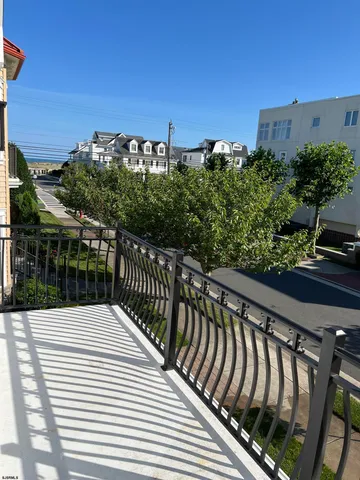 a view of balcony with wooden floor and city view