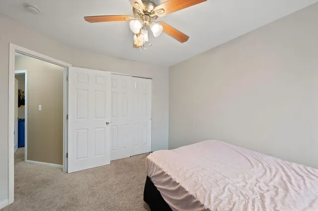 a bedroom with a bed and flat screen tv