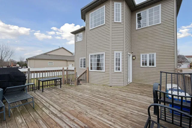 a swimming pool with outdoor seating and yard