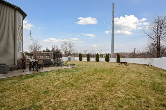 a view of a swimming pool and a yard