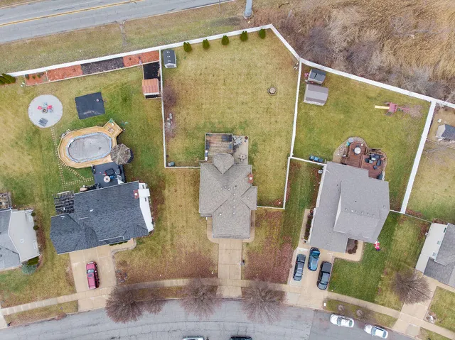 an aerial view of a house with a swimming pool