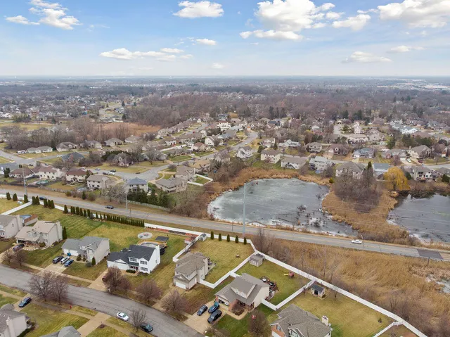 an aerial view of a house with a swimming pool