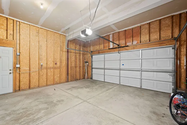 a view of a dining room with furniture and a window