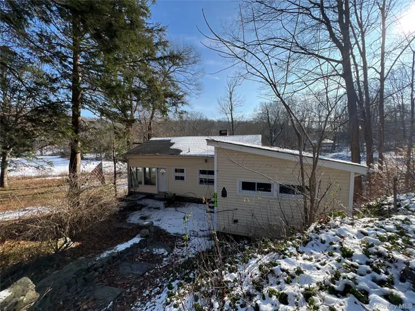 a view of a backyard of the house