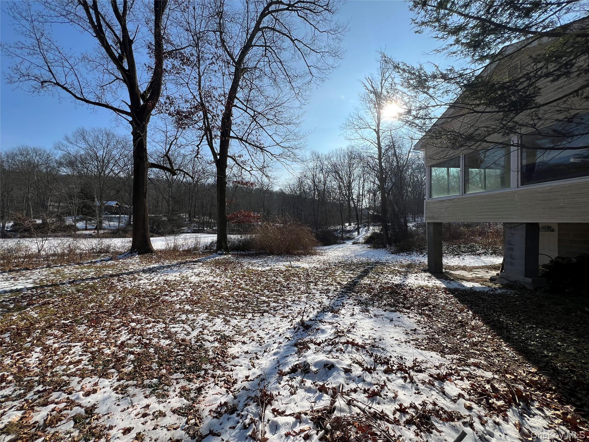 298 Old Albany Post Road Garrison, NY 10524 - Photo 14 of 18 a backyard of a house with lots of green space