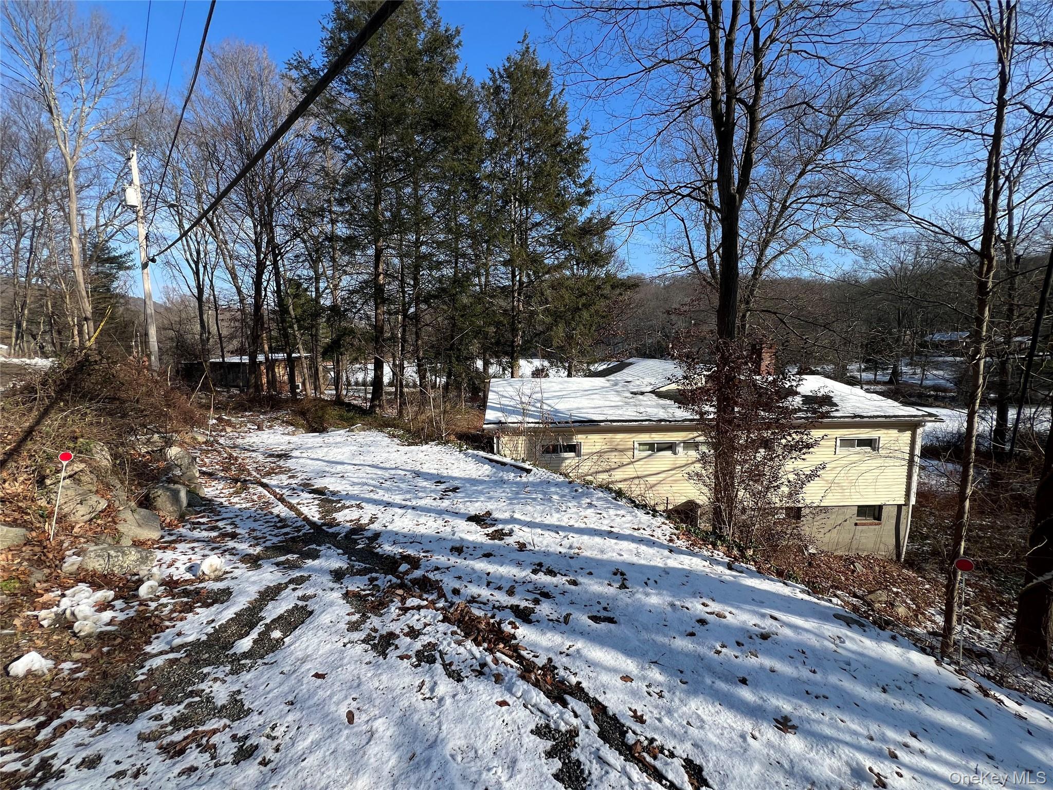298 Old Albany Post Road Garrison, NY 10524 - Photo 3 of 18 a view of a yard with wooden fence