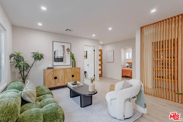 a view of a dining room with furniture and window