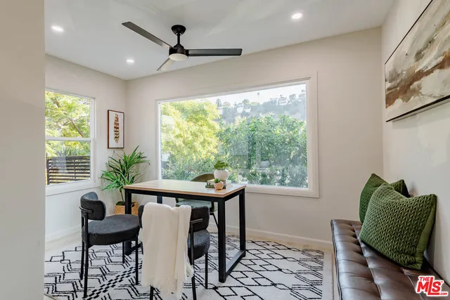 a view of a dining room with furniture window and outside view