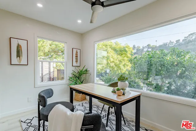 a bedroom with furniture and window